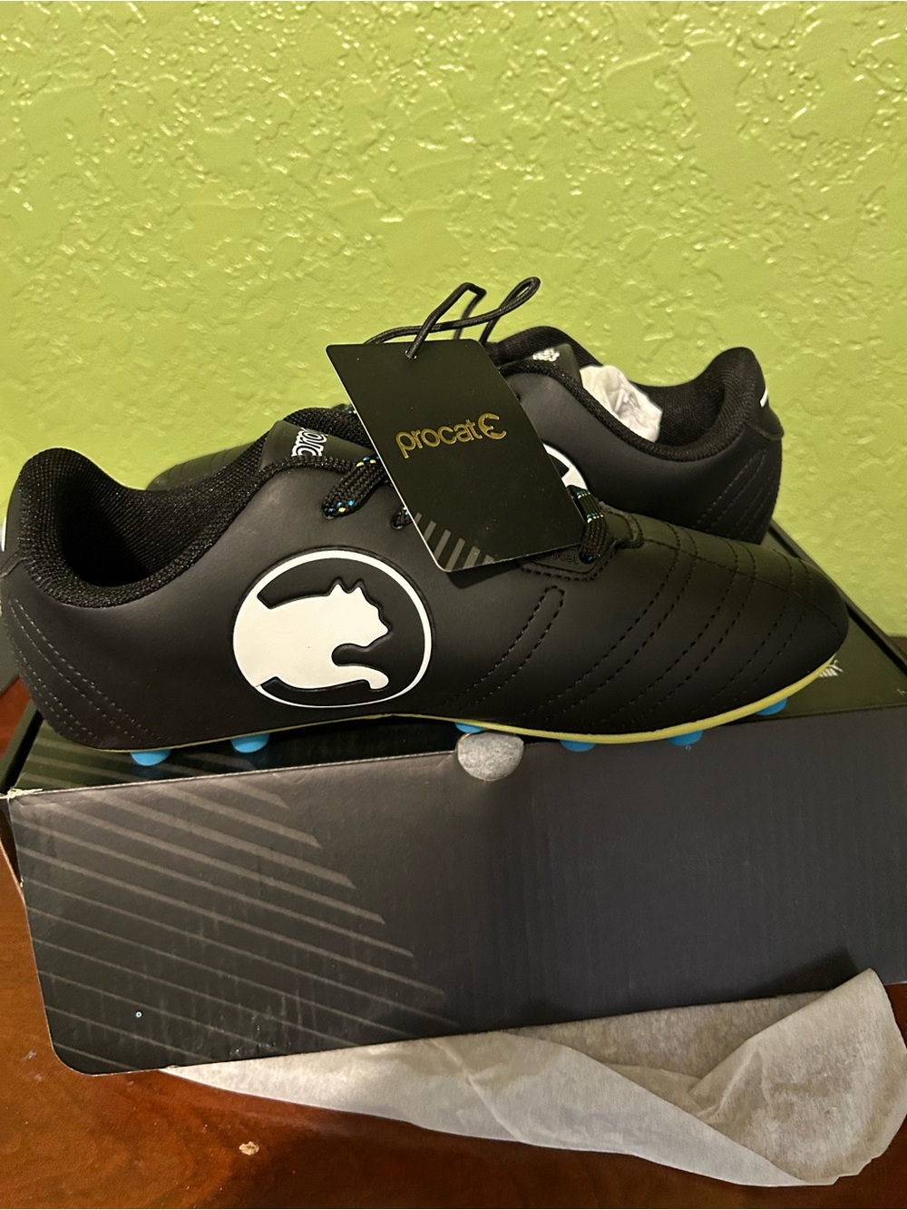 Puma Black and Yellow Soccer Cleats with Blue Studs